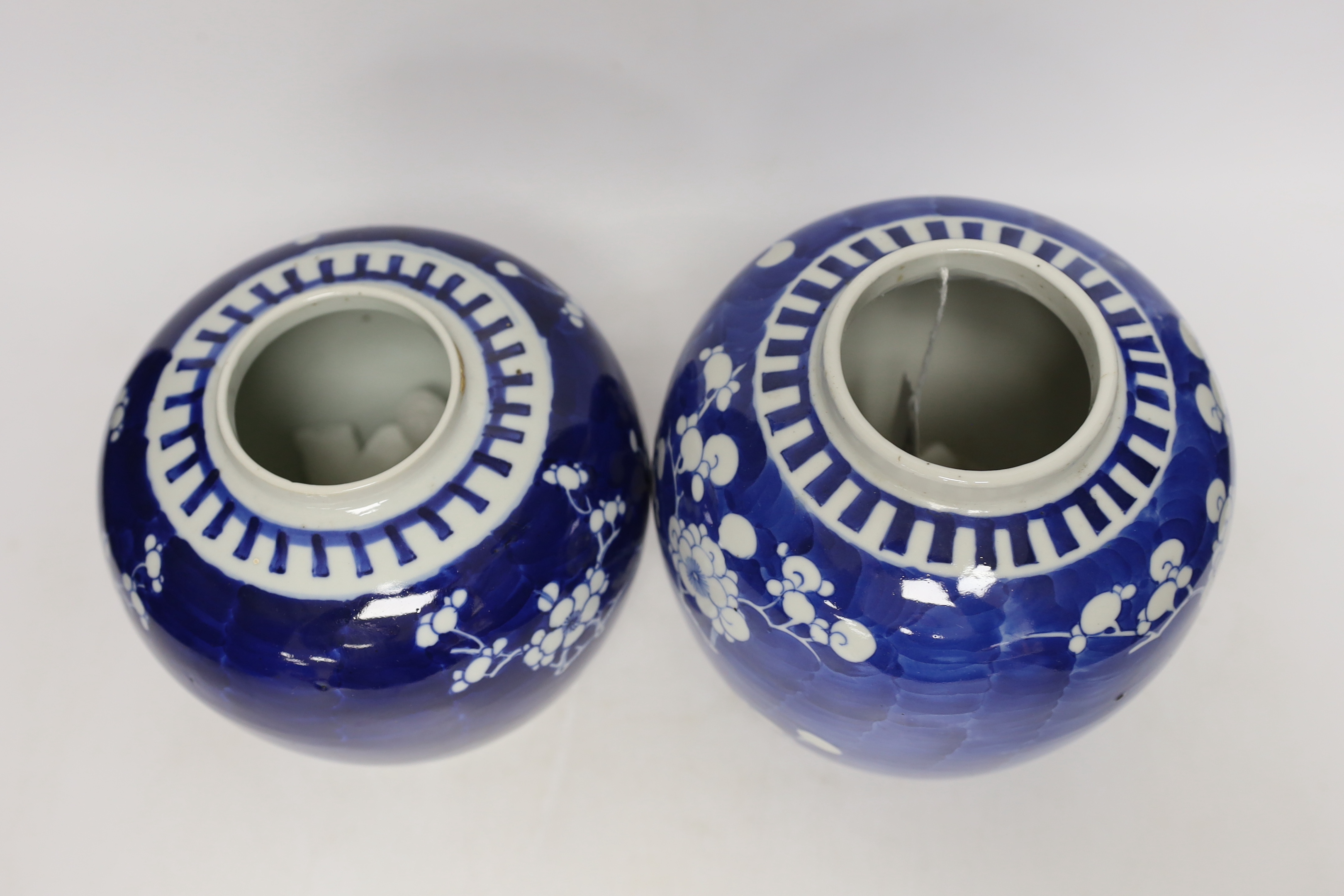 Two Chinese blue and white prunus jars, and a famille verte powder blue bowl, late 19th/early 20th century, tallest 17.5cm